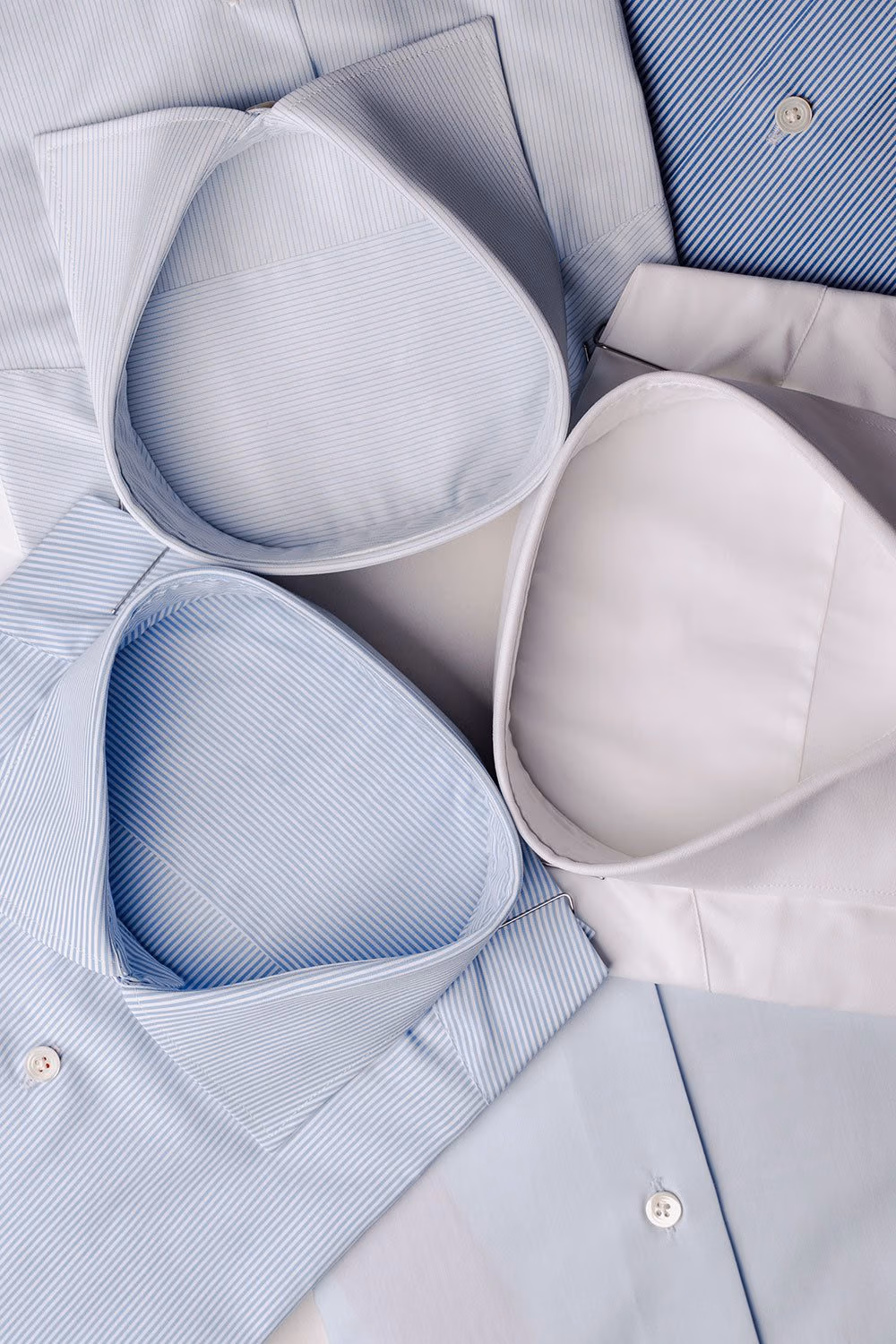 Folded light blue dress shirts